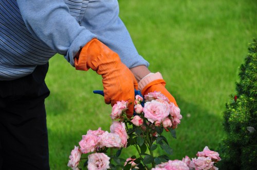 Worker wearing PPE including boots, gloves and hi-vis jacket